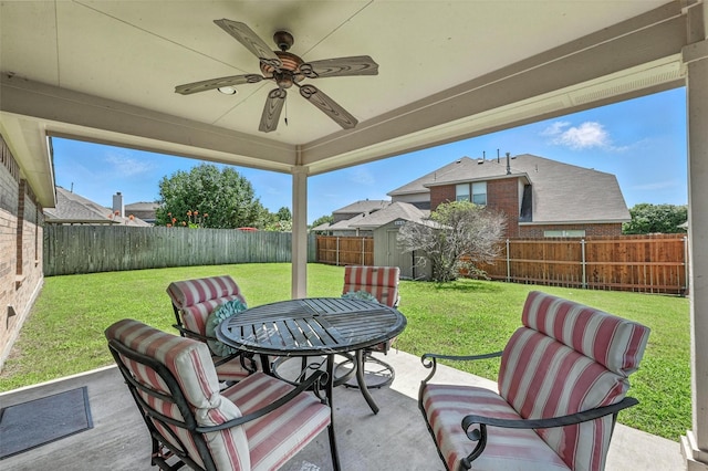 9210 Wild River Dr, Arlington, TX 76002 - fenced backyard with a ceiling fan, a patio area, outdoor dining space, and a shed