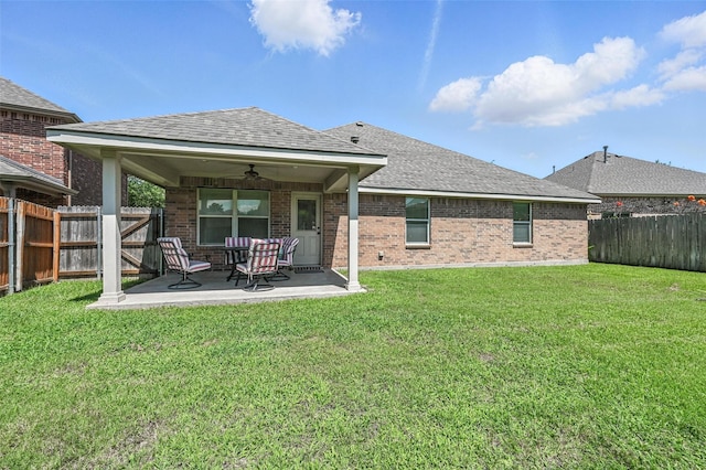9210 Wild River Dr, Arlington, TX 76002 - rear view of property with a ceiling fan, a patio, brick siding, a fenced backyard, and a shingled roof