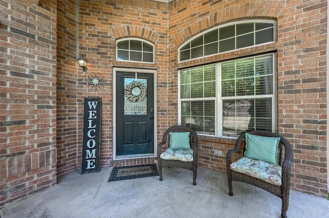 9210 Wild River Dr, Arlington, TX 76002 - view of exterior entry with brick siding and a porch
