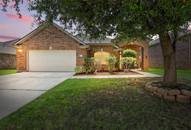 9210 Wild River Dr, Arlington, TX 76002 - view of front of property featuring brick siding, an attached garage, concrete driveway, and a lawn