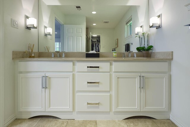 4232 Meadowdale Ln, Dallas, TX 75229 - bathroom with double vanity, tile patterned flooring, and recessed lighting