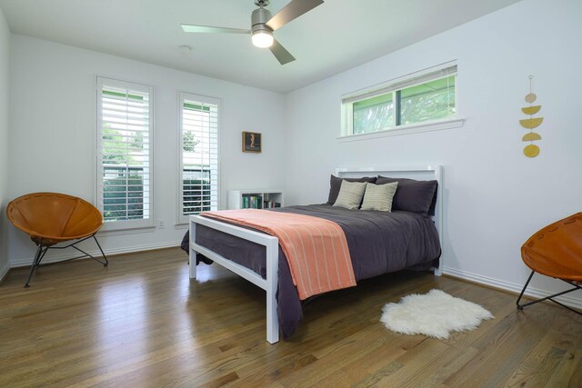4232 Meadowdale Ln, Dallas, TX 75229 - bedroom with multiple windows, wood finished floors, and ceiling fan