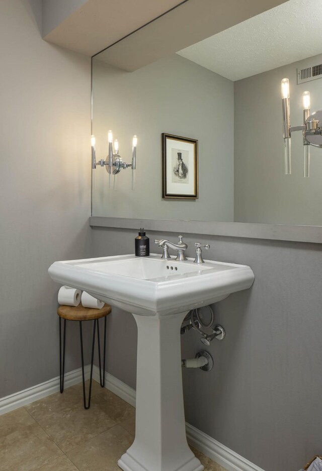4232 Meadowdale Ln, Dallas, TX 75229 - bathroom featuring tile patterned floors and a textured ceiling