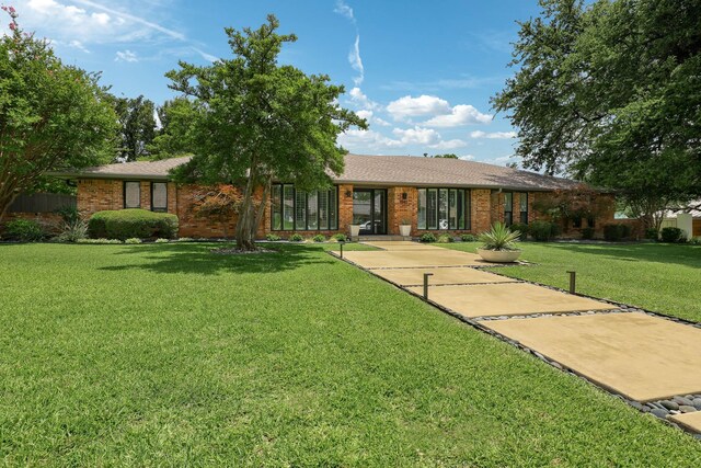 4232 Meadowdale Ln, Dallas, TX 75229 - single story home with brick siding and a front lawn
