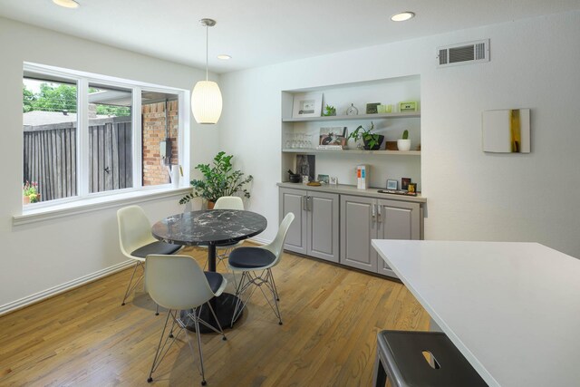 4232 Meadowdale Ln, Dallas, TX 75229 - dining area featuring light wood-style flooring and recessed lighting
