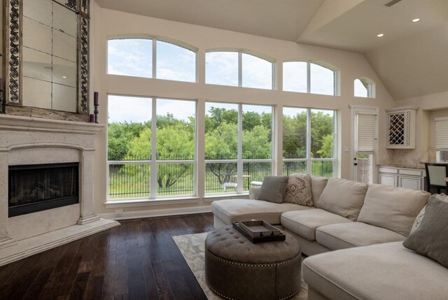 6812 S Fork Dr, North Richland Hills, TX 76182 - living area featuring dark wood-type flooring, a fireplace, recessed lighting, and high vaulted ceiling
