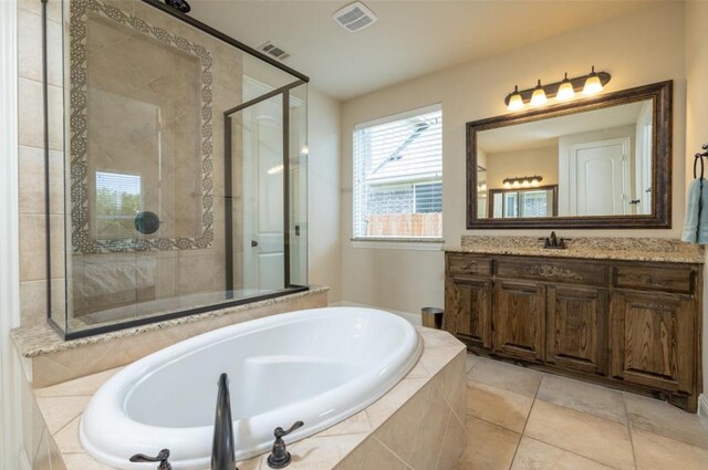 6812 S Fork Dr, North Richland Hills, TX 76182 - bathroom with a stall shower, a garden tub, vanity, and tile patterned flooring