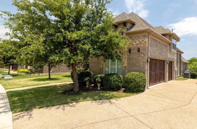 6812 S Fork Dr, North Richland Hills, TX 76182 - view of property exterior featuring brick siding, concrete driveway, a garage, a lawn, and a shingled roof