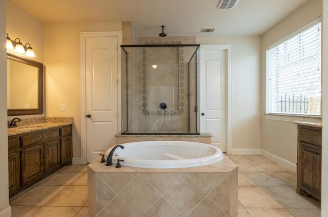 6812 S Fork Dr, North Richland Hills, TX 76182 - bathroom featuring a shower stall, a garden tub, vanity, and tile patterned flooring