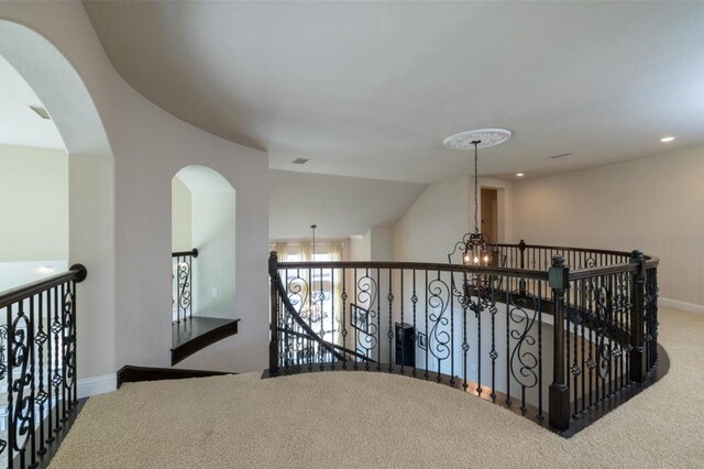 6812 S Fork Dr, North Richland Hills, TX 76182 - hallway with carpet, an upstairs landing, a chandelier, and recessed lighting