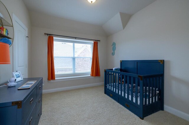 6812 S Fork Dr, North Richland Hills, TX 76182 - bedroom with carpet floors, a nursery area, and vaulted ceiling