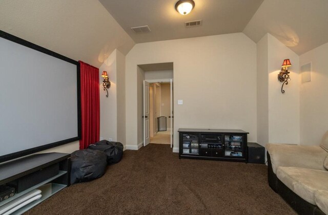 6812 S Fork Dr, North Richland Hills, TX 76182 - home theater room with vaulted ceiling and carpet