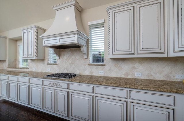 6812 S Fork Dr, North Richland Hills, TX 76182 - kitchen featuring custom exhaust hood, stainless steel gas cooktop, decorative backsplash, and stone counters