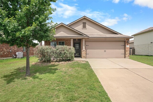 6521 La Sol Ln, Waco, TX 76712 - view of front of home with a garage, driveway, brick siding, and a front lawn