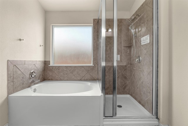 6521 La Sol Ln, Waco, TX 76712 - full bathroom with a garden tub and a stall shower
