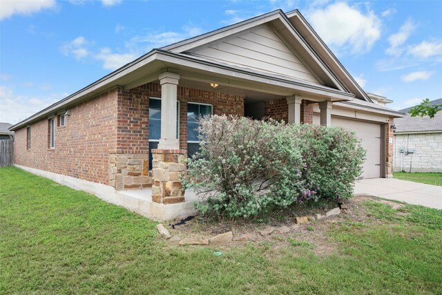 6521 La Sol Ln, Waco, TX 76712 - view of front of house with brick siding, concrete driveway, a front lawn, and a garage