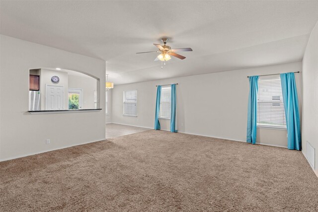 6521 La Sol Ln, Waco, TX 76712 - unfurnished room featuring ceiling fan, carpet flooring, and arched walkways