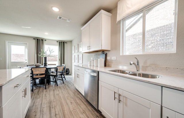 7518 Fenton Pkwy, Pilot Point, TX 76258 - kitchen featuring dishwasher, light wood-style floors, recessed lighting, white cabinets, and light stone countertops