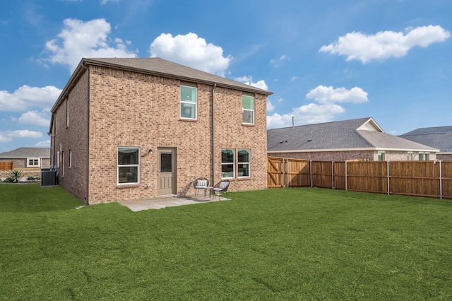7518 Fenton Pkwy, Pilot Point, TX 76258 - rear view of property with a fenced backyard, brick siding, and a patio