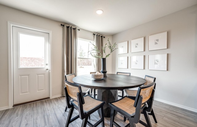 7518 Fenton Pkwy, Pilot Point, TX 76258 - dining area with baseboards and light wood-type flooring