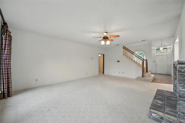 2116 S Winding Creek Dr, Grapevine, TX 76051 - unfurnished living room with a ceiling fan, stairs, and carpet