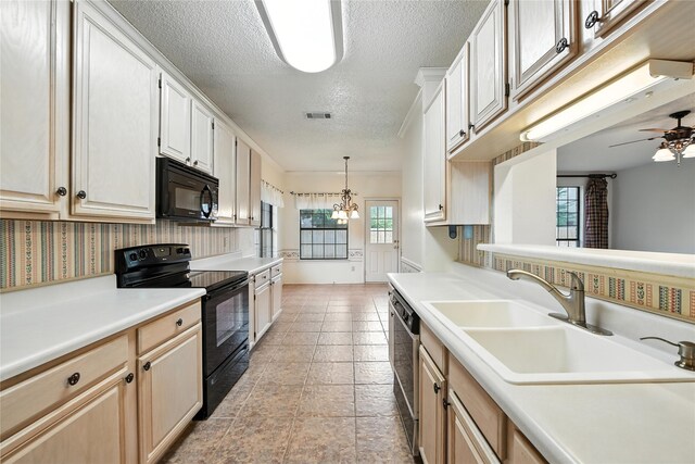 2116 S Winding Creek Dr, Grapevine, TX 76051 - kitchen with black appliances, a textured ceiling, light countertops, hanging light fixtures, and a ceiling fan