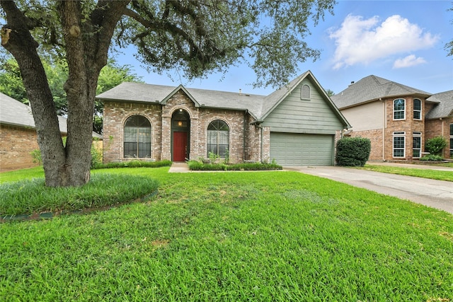 2116 S Winding Creek Dr, Grapevine, TX 76051 - view of front of home with brick siding, concrete driveway, an attached garage, and a front lawn