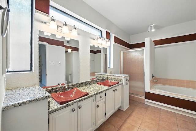 2116 S Winding Creek Dr, Grapevine, TX 76051 - bathroom featuring a stall shower, double vanity, a garden tub, and tile patterned floors