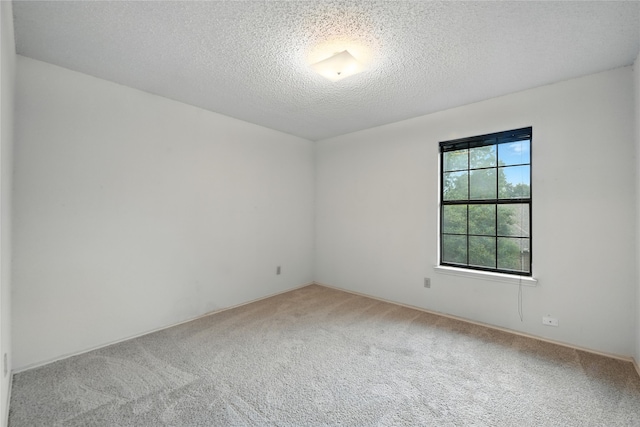 2116 S Winding Creek Dr, Grapevine, TX 76051 - carpeted spare room featuring a textured ceiling