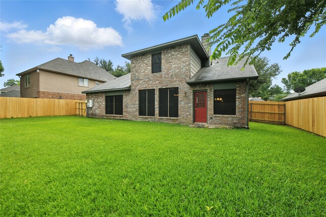 2116 S Winding Creek Dr, Grapevine, TX 76051 - back of house featuring brick siding, a fenced backyard, a chimney, and a shingled roof