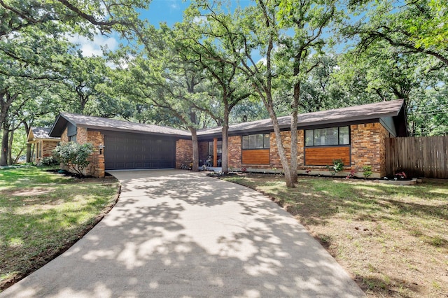 612 Circleview Dr S, Hurst, TX 76054 - mid-century inspired home with brick siding, an attached garage, and driveway