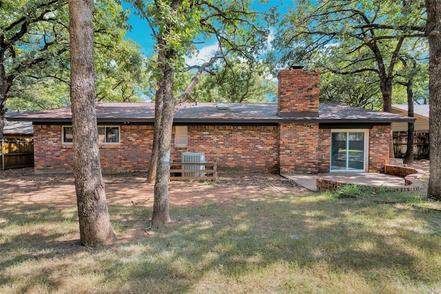 612 Circleview Dr S, Hurst, TX 76054 - rear view of house with a chimney, brick siding, a patio area, and a shingled roof