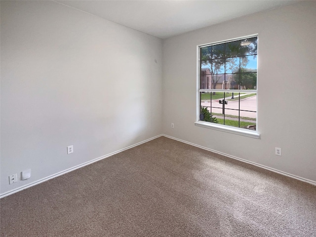 1207 Whitecreek Dr, Glenn Heights, TX 75154 - spare room featuring dark colored carpet and baseboards