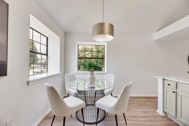 552 Kirkland Dr, Coppell, TX 75019 - dining area featuring light wood-style floors and a textured ceiling