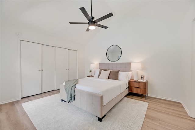 552 Kirkland Dr, Coppell, TX 75019 - bedroom with light wood-style floors, a closet, high vaulted ceiling, and ceiling fan