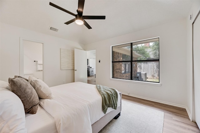 552 Kirkland Dr, Coppell, TX 75019 - bedroom featuring light wood finished floors, connected bathroom, and a ceiling fan