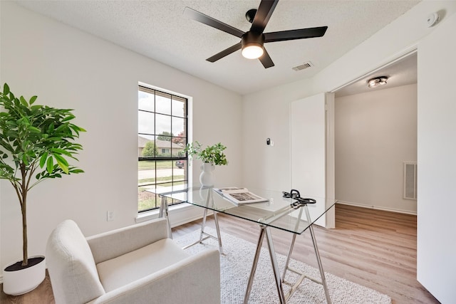 552 Kirkland Dr, Coppell, TX 75019 - office area featuring healthy amount of natural light, light wood-style flooring, a ceiling fan, and a textured ceiling