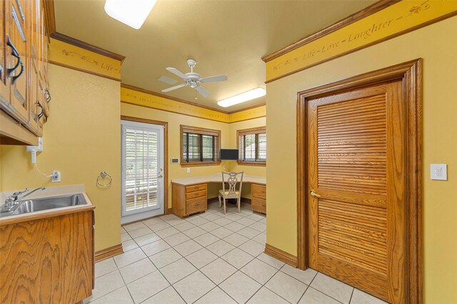 207 Baker Park Dr, Sherman, TX 75092 - kitchen featuring a ceiling fan, light tile patterned flooring, light countertops, and built in study area