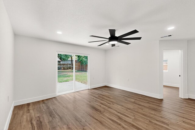 1822 Robinson St, Irving, TX 75060 - spare room featuring wood finished floors, recessed lighting, and a ceiling fan