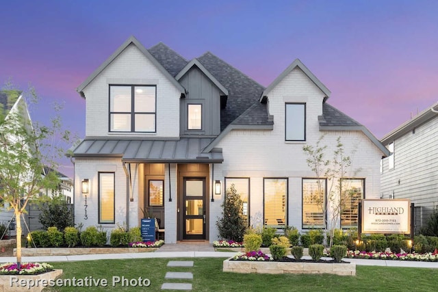 3617 Barrel Ln, Aubrey, TX 76227 - view of front of home featuring a standing seam roof, a lawn, and brick siding