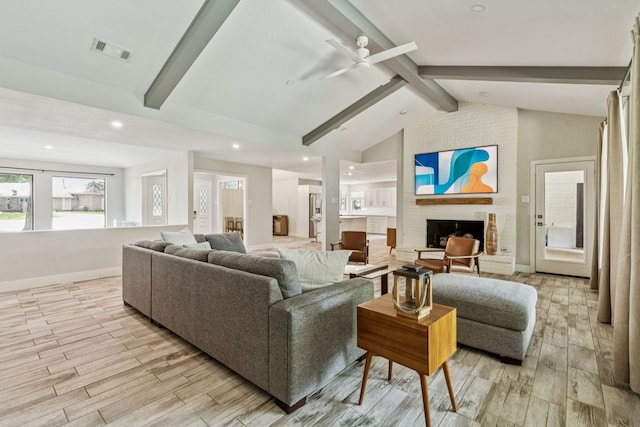 6010 Preston Creek Dr, Dallas, TX 75240 - living room with light wood-style floors, beam ceiling, a ceiling fan, a fireplace, and recessed lighting