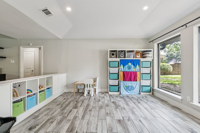 6010 Preston Creek Dr, Dallas, TX 75240 - playroom with wood finished floors, recessed lighting, and lofted ceiling