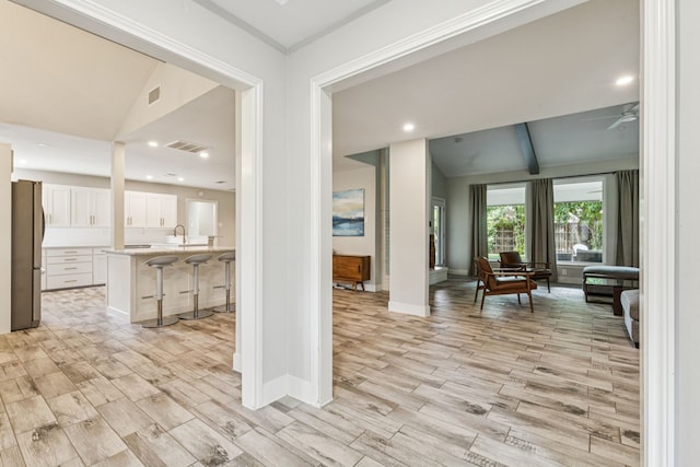 6010 Preston Creek Dr, Dallas, TX 75240 - hall with lofted ceiling, wood finish floors, and recessed lighting