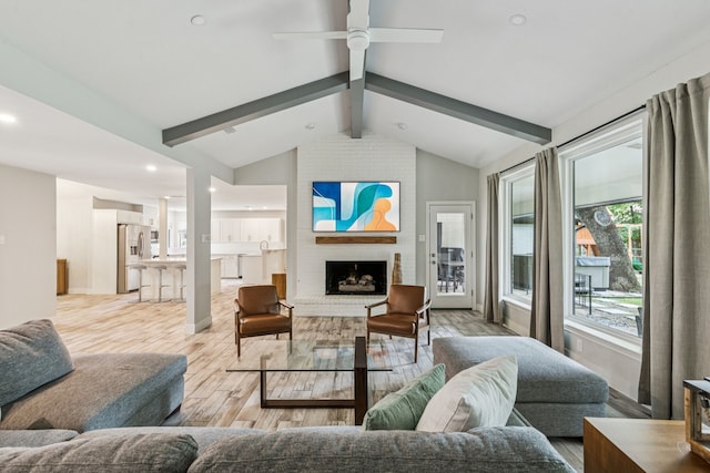 6010 Preston Creek Dr, Dallas, TX 75240 - living room with light wood-style floors, ceiling fan, a brick fireplace, and recessed lighting