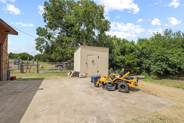 567 Celtic Rd, Howe, TX 75459 - view of patio featuring a storage unit and a gate