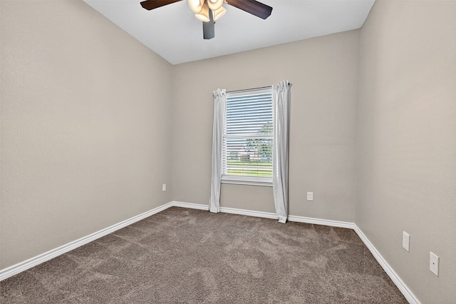 515 W Broad St, Pilot Point, TX 76258 - spare room featuring a ceiling fan and dark carpet
