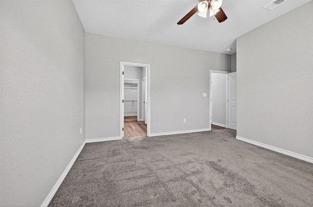 515 W Broad St, Pilot Point, TX 76258 - unfurnished bedroom featuring carpet floors, a ceiling fan, and connected bathroom