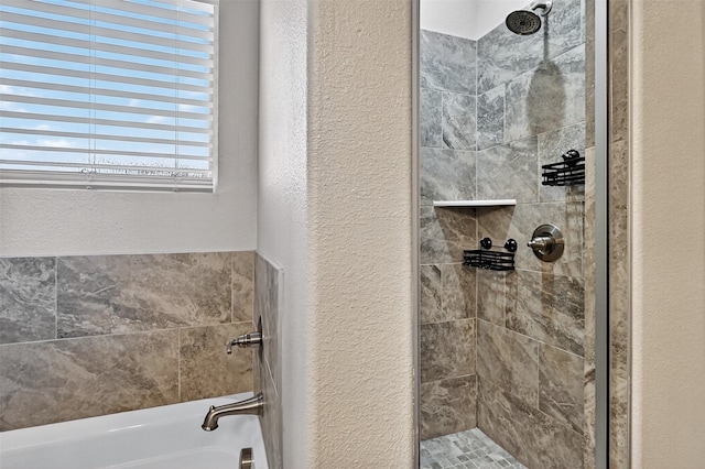 515 W Broad St, Pilot Point, TX 76258 - full bathroom featuring a textured wall, a tile shower, and a bath