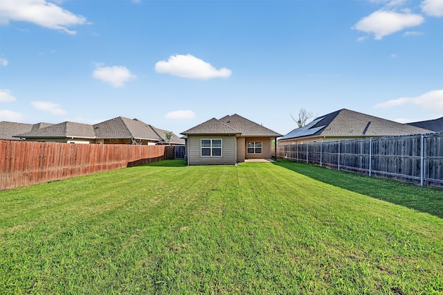 515 W Broad St, Pilot Point, TX 76258 - back of house with a fenced backyard