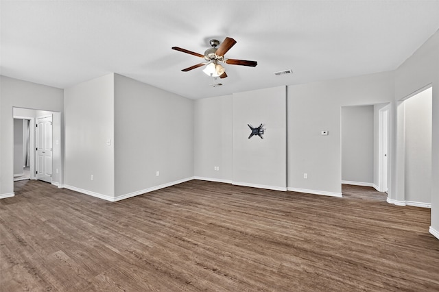 515 W Broad St, Pilot Point, TX 76258 - unfurnished living room featuring ceiling fan and dark wood finished floors